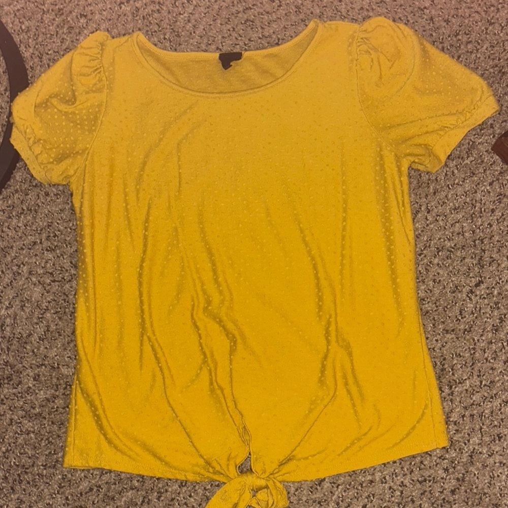 Mustard Yellow textured Women's Top with tie at the bottom of the shirt.